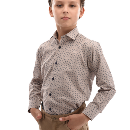 A Moustache Kids model wearing a clean brown shirt. The shirt has dandelion prints on it. 